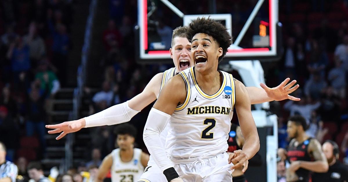 Michigan's Jordan Poole celebrates his buzzer-beater over Houston.